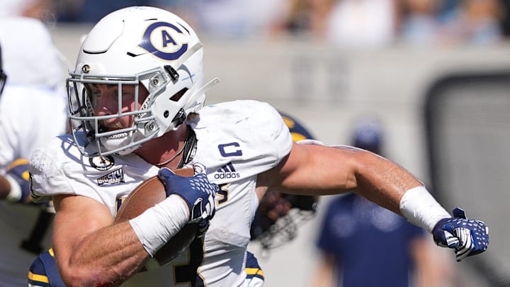 Aug 31, 2024; Berkeley, California, USA; UC Davis Aggies running back Lan Larison (3) carries the ball against the California Golden Bears during the second quarter at California Memorial Stadium. Mandatory Credit: Darren Yamashita-Imagn Images