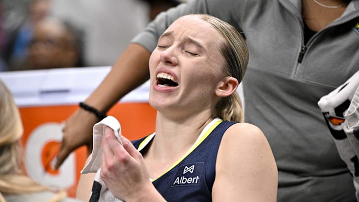 Aug 1, 2025; Dallas, Texas, USA;  Dallas Wings guard Paige Bueckers (5) sits on the team bench after suffering an apparent leg injury during the second half against the Indiana Fever at the American Airlines Center. Mandatory Credit: Jerome Miron-Imagn Images