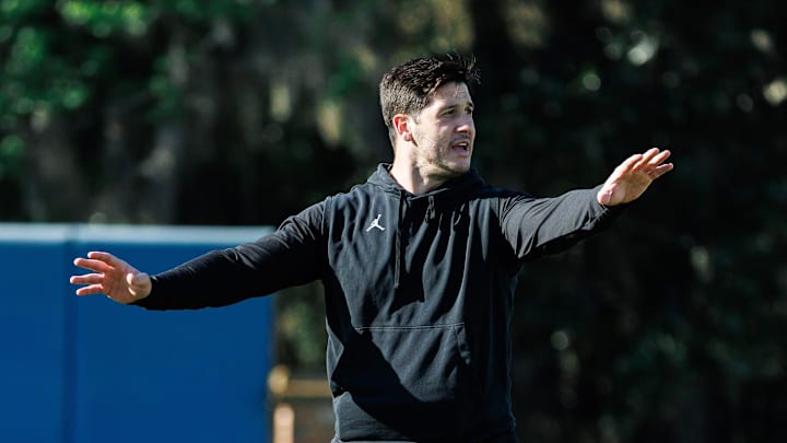 Florida Gators co-defensive coordinator Vinnie Sunseri gestures while Florida Gators inside linebacker Jaden Robinson (29) watches during spring football practice at Heavener Football Complex at the University of Florida in Gainesville, FL on Tuesday, March 11, 2025. [Matt Pendleton/Gainesville Sun]