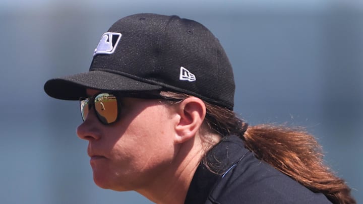 MLB umpire Jen Pawol watches from first base during the game between the St. Louis Cardinals and the Washington Nationals at Roger Dean Chevrolet Stadium in 2024. MLB umpire Jen Pawol watches from first base during the game between the St. Louis Cardinals and the Washington Nationals at Roger Dean Chevrolet Stadium in 2024.