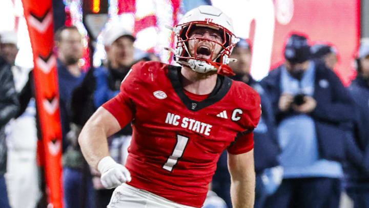 Nov 29, 2025; Raleigh, North Carolina, USA; NC State Wolfpack linebacker Caden Fordham (1) reacts to his tackle during the first half of the game against North Carolina Tar Heels at Carter-Finley Stadium.  Mandatory Credit: Jaylynn Nash-Imagn Images