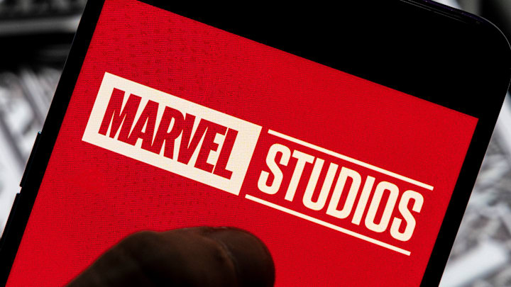 In this photo illustration, a Marvel Studios logo seen...
