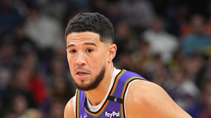 Jan 11, 2025; Phoenix, Arizona, USA; Phoenix Suns guard Devin Booker (1) dribbles against the Utah Jazz during the second half at Footprint Center. Mandatory Credit: Joe Camporeale-Imagn Images