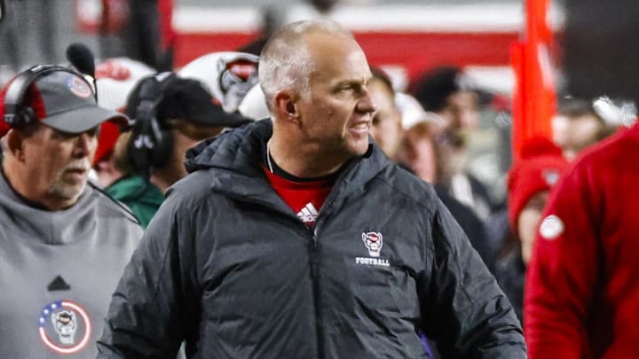 Nov 29, 2025; Raleigh, North Carolina, USA; NC State Wolfpack head coach Dave Doeren reacts during the first half of the game against North Carolina Tar Heels at Carter-Finley Stadium.  Mandatory Credit: Jaylynn Nash-Imagn Images