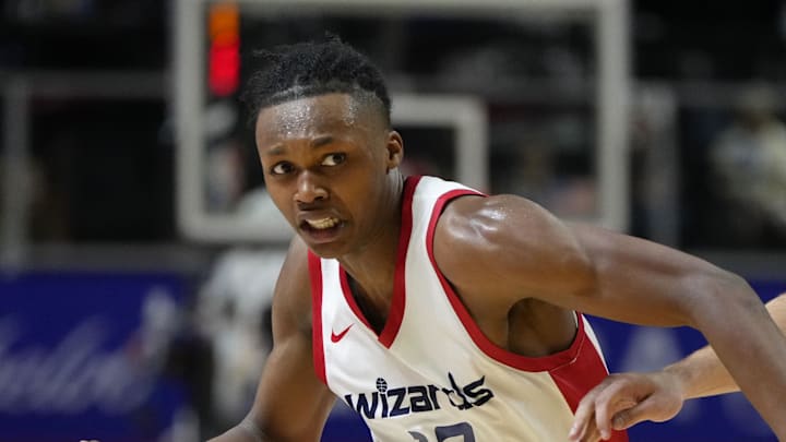 Jul 12, 2024; Las Vegas, NV, USA;  Washington Wizards guard Bub Carrington (17) drives the ball against Atlanta Hawks guard Nikola Durisic (7) during the second half at Thomas & Mack Center. Mandatory Credit: Lucas Peltier-Imagn Images