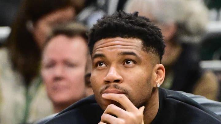 Milwaukee Bucks forward Giannis Antetokounmpo looks on from the bench.