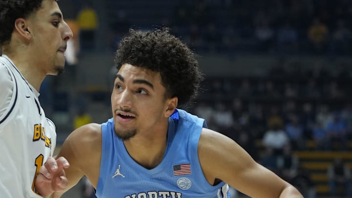 Jan 17, 2026; Berkeley, California, USA; North Carolina Tar Heels guard Derek Dixon (3) dribbles against California Golden Bears guard Justin Pippen (left) during the first half at Haas Pavilion. Mandatory Credit: Darren Yamashita-Imagn Images