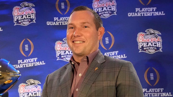 Texas head coach Steve Sarkisian and Arizona State head coach Kenny Dillingham pose for photos before facing off in the Chick-fil-A Peach Bowl. Texas head coach Steve Sarkisian and Arizona State head coach Kenny Dillingham pose for photos before facing off in the Chick-fil-A Peach Bowl.