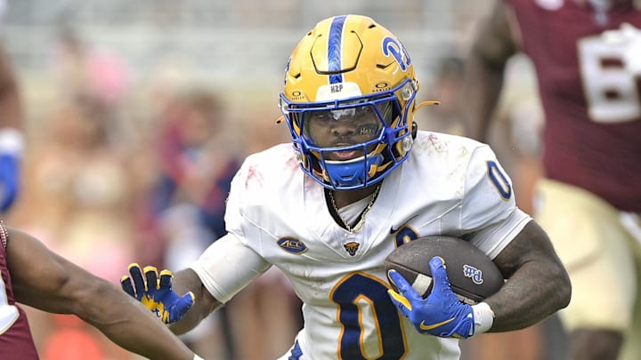 Oct 11, 2025; Tallahassee, Florida, USA; Pittsburgh Panthers running back Desmond Reid (0) runs the ball past Florida State Seminoles defensive back Jerry Wilson (19) during the second half at Doak S. Campbell Stadium. Mandatory Credit: Melina Myers-Imagn Images Oct 11, 2025; Tallahassee, Florida, USA; Pittsburgh Panthers running back Desmond Reid (0) runs the ball past Florida State Seminoles defensive back Jerry Wilson (19) during the second half at Doak S. Campbell Stadium. Mandatory Credit: Melina Myers-Imagn Images
