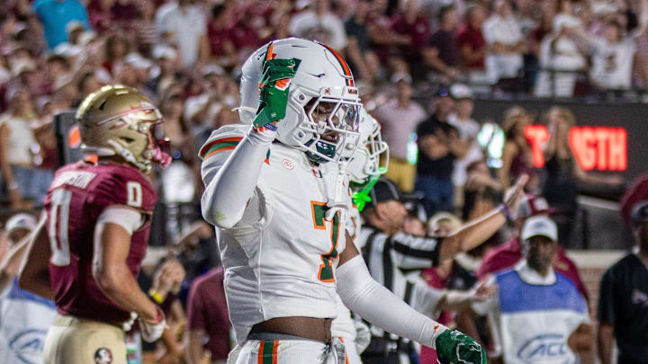 University of Miami safety Zechariah Poyser (7) celebrates after defending Florida State University wide receiver Duce Robinson (0).
