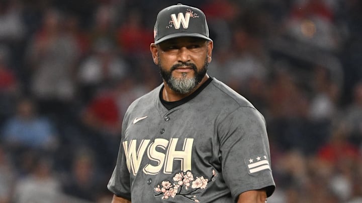 Aug 2, 2024; Washington, District of Columbia, USA; Washington Nationals manager Dave Martinez (4) walks back to the dugout against the Milwaukee Brewers during the sixth inning at Nationals Park Aug 2, 2024; Washington, District of Columbia, USA; Washington Nationals manager Dave Martinez (4) walks back to the dugout against the Milwaukee Brewers during the sixth inning at Nationals Park
