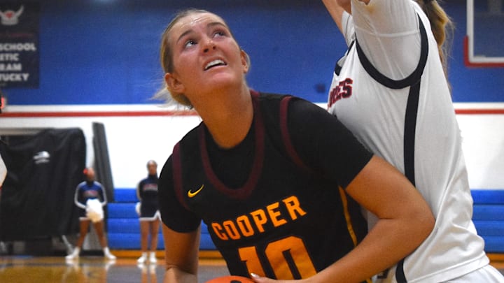 Cooper High School junior Haylee Noel positions herself for a shot in the post Jan. 2, 2026 as Sacred Heart High School's Amirah Jordan looks on. Cooper High School junior Haylee Noel positions herself for a shot in the post Jan. 2, 2026 as Sacred Heart High School's Amirah Jordan looks on.