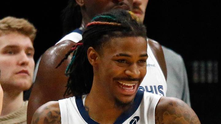 Memphis Grizzlies guard Ja Morant watches from the bench.