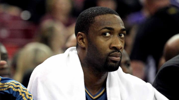 December 8, 2010; Sacramento, CA, USA; Washington Wizards guard John Wall (left) sits on the bench next to guard Gilbert Arenas (right) against the Sacramento Kings in the first quarter at Arco Arena. Mandatory Credit: Cary Edmondson-Imagn Images