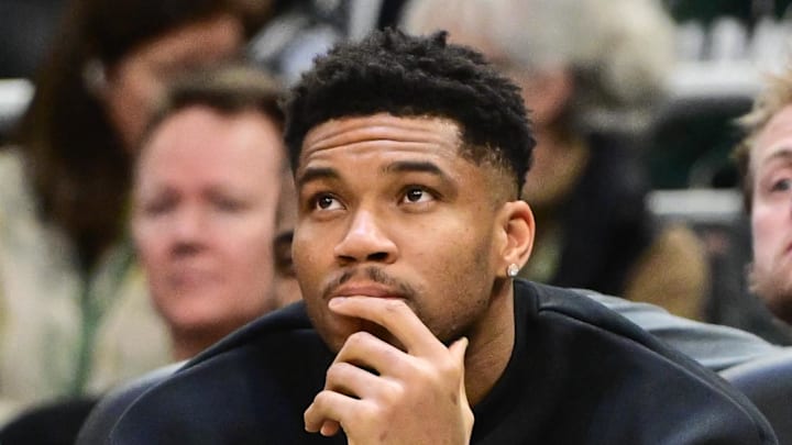 Milwaukee Bucks forward Giannis Antetokounmpo (34) looks on from the bench while recovering from an injury in the second quarter against the Boston Celtics at Fiserv Forum on December 11, 2025.