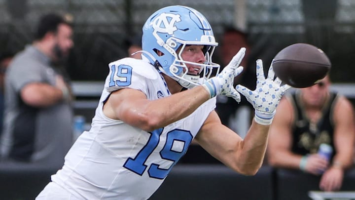 Sep 20, 2025; Orlando, Florida, USA; North Carolina Tar Heels tight end Jake Johnson (19) catches a pass during the second half against the UCF Knights at the Bounce House Stadium. Mandatory Credit: Mike Watters-Imagn Images