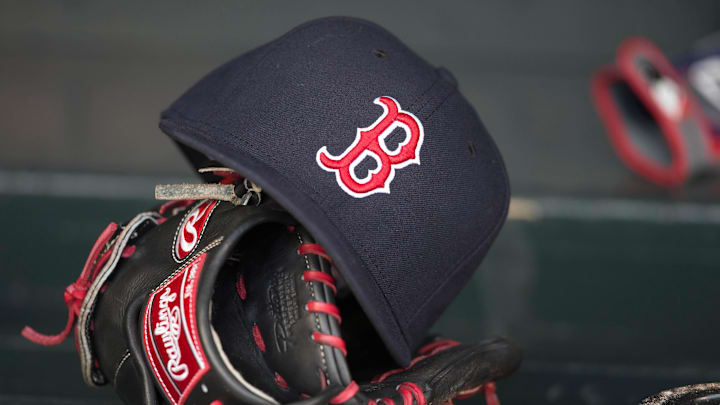 May 14, 2014; Minneapolis, MN, USA; A general view of a glove and Boston Red Sox hat in the dugout prior to a game between the Boston Red Sox and Minnesota Twins at Target Field. Mandatory Credit: Jesse Johnson-Imagn Images