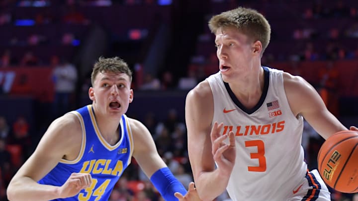 Feb 11, 2025; Champaign, Illinois, USA; Illinois Fighting Illini forward Ben Humrichous (3) drives the ball past UCLA Bruins forward Tyler Bilodeau (34) during the first half at State Farm Center. Mandatory Credit: Ron Johnson-Imagn Images Feb 11, 2025; Champaign, Illinois, USA; Illinois Fighting Illini forward Ben Humrichous (3) drives the ball past UCLA Bruins forward Tyler Bilodeau (34) during the first half at State Farm Center. Mandatory Credit: Ron Johnson-Imagn Images