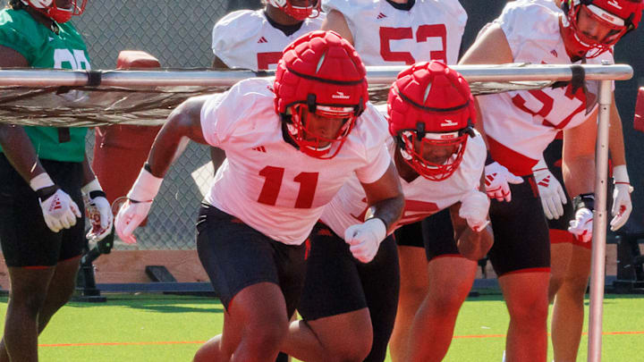 Nebraska defensive linemen Cameron Lenhardt and Elijah Jeudy go through a drill during practice Monday morning.