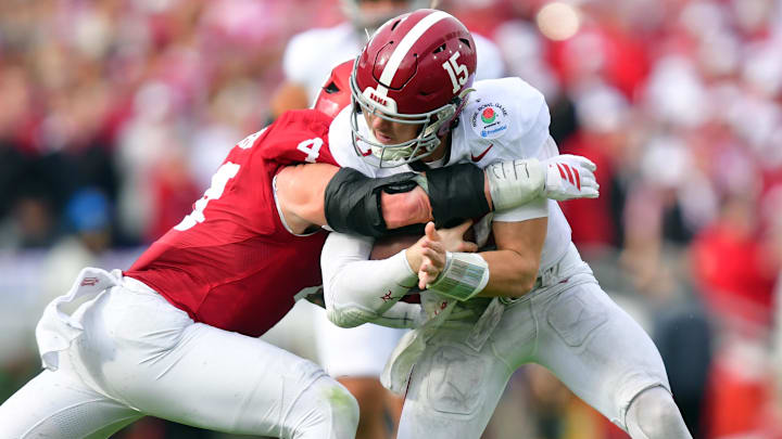 Alabama Crimson Tide quarterback Ty Simpson (15) runs against Indiana Hoosiers linebacker Aiden Fisher (4)