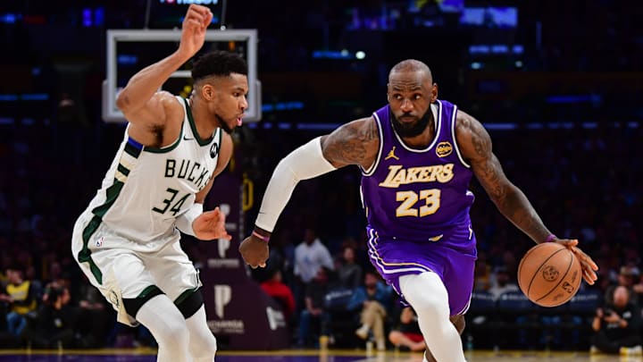 Jan 9, 2026; Los Angeles, California, USA; Los Angeles Lakers forward LeBron James (23) moves the ball against Milwaukee Bucks forward Giannis Antetokounmpo (34) during the second half at Crypto.com Arena. Mandatory Credit: Gary A. Vasquez-Imagn Images