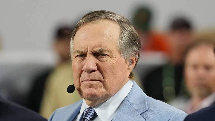 Jan 19, 2026; Miami Gardens, FL, USA; TV analyst Bill Belichick watches the Miami Hurricanes play the Indiana Hoosiers during the first half of the College Football Playoff National Championship game at Hard Rock Stadium. Mandatory Credit: Kirby Lee-Imagn Images Jan 19, 2026; Miami Gardens, FL, USA; TV analyst Bill Belichick watches the Miami Hurricanes play the Indiana Hoosiers during the first half of the College Football Playoff National Championship game at Hard Rock Stadium. Mandatory Credit: Kirby Lee-Imagn Images