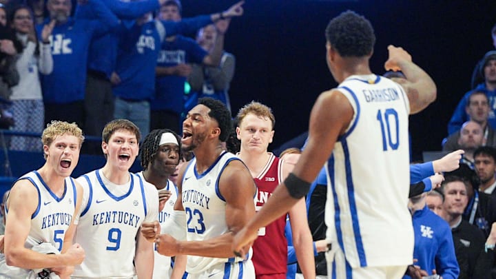 The Kentucky bench erupts after Kentucky Wildcats forward Mouhamed Dioubate (23) helped create a turnover on the Hoosiers as Indiana Hoosiers forward Tucker Devries (12) looks on as the Cats beat Indiana 72-60 during college basketball at Rupp Arena in Lexington, Kentucky December 13, 2025.