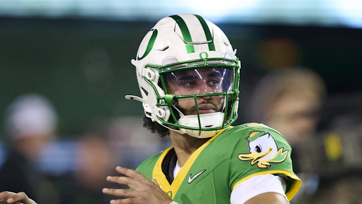 Oregon Ducks quarterback Dante Moore warms up before a game against the Minnesota Golden Gophers at Autzen Stadium.