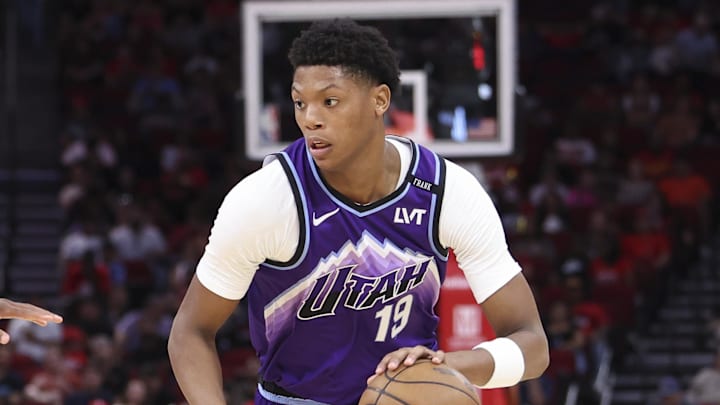 Oct 8, 2025; Houston, Texas, USA; /Utah Jazz forward Ace Bailey (19) dribbles the ball as Houston Rockets forward Jabari Smith Jr. (10) defends during the second quarter at Toyota Center. Mandatory Credit: Troy Taormina-Imagn Images