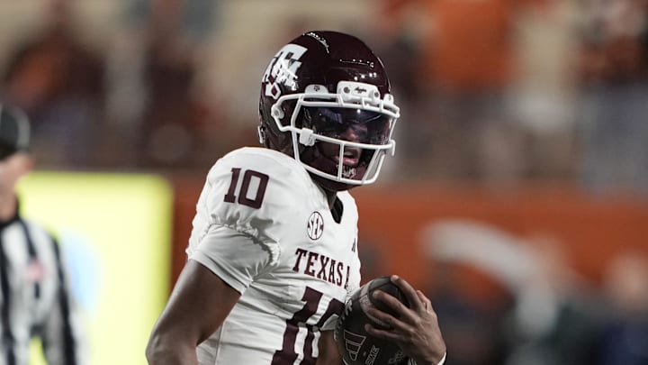 Nov 28, 2025; Austin, Texas, USA; Texas A&M Aggies quarterback Marcel Reed (10) keeps the ball for yards during the first half against the Texas Longhorns at Darrell K Royal-Texas Memorial Stadium. Mandatory Credit: Scott Wachter-Imagn Images Nov 28, 2025; Austin, Texas, USA; Texas A&M Aggies quarterback Marcel Reed (10) keeps the ball for yards during the first half against the Texas Longhorns at Darrell K Royal-Texas Memorial Stadium. Mandatory Credit: Scott Wachter-Imagn Images