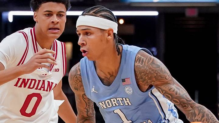 Oct 18, 2026; Indianapolis, IN, USA; North Carolina Tar Heels guard Terrence Brown (1) dribbles the ball against Indiana Hoosiers forward Trevor Manhertz (0) during the first half at Gainbridge Fieldhouse. Mandatory Credit: Robert Goddin-Imagn Images