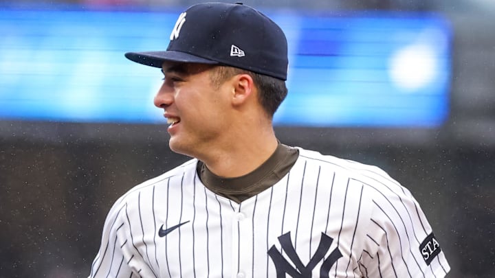 Apr 12, 2025; Bronx, New York, USA; New York Yankees shortstop Anthony Volpe (11) reacts with third base Oswaldo Cabrera (95) after getting the third out against the San Francisco Giants during the third inning at Yankee Stadium. Mandatory Credit: Tom Horak-Imagn Images