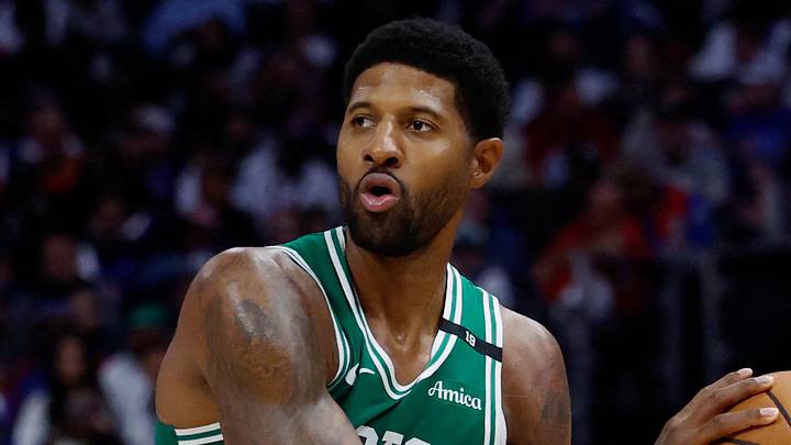 Oct 20, 2026; Detroit, Michigan, USA;  Boston Celtics forward Paul George (13) is defended by Detroit Pistons forward-center John Collins (20) in the second half at Little Caesars Arena.  Mandatory Credit: Rick Osentoski-Imagn Images