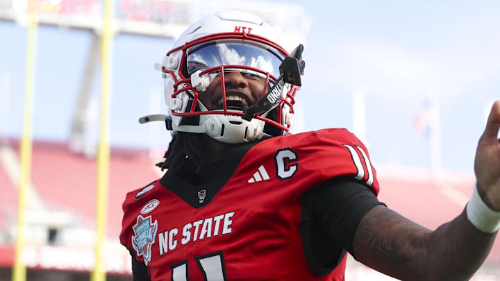 Dec 19, 2025; Tampa, FL, USA; NC State Wolfpack quarterback CJ Bailey (11) runs into the end zone for a touchdown against the Memphis Tigers in the first quarter during the Gasparilla Bowl at Raymond James Stadium. Mandatory Credit: Nathan Ray Seebeck-Image Images Dec 19, 2025; Tampa, FL, USA; NC State Wolfpack quarterback CJ Bailey (11) runs into the end zone for a touchdown against the Memphis Tigers in the first quarter during the Gasparilla Bowl at Raymond James Stadium. Mandatory Credit: Nathan Ray Seebeck-Image Images