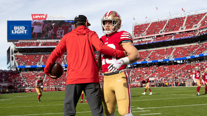 San Francisco 49ers head coach Kyle Shanahan (L) and running back Christian McCaffrey (R)