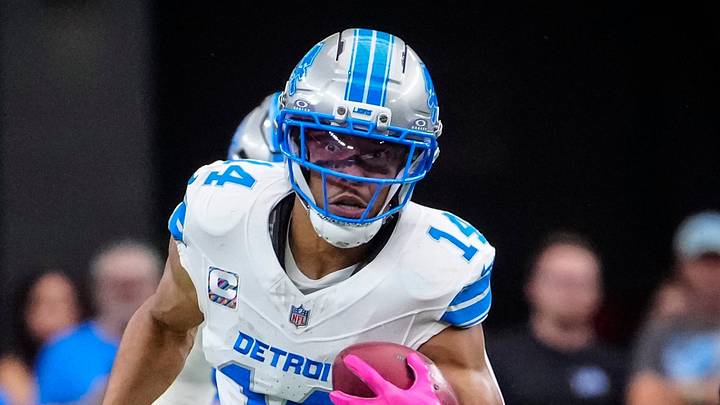 Detroit Lions receiver Amon-Ra St. Brown (14) returns a punt against the Arizona Cardinals 