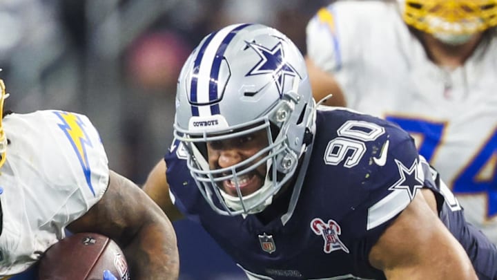 Dec 21, 2025; Arlington, Texas, USA; Los Angeles Chargers running back Omarion Hampton (8) rushes ahead of Dallas Cowboys defensive tackle Solomon Thomas (90) during the fourth quarter at AT&T Stadium. Mandatory Credit: Kevin Jairaj-Imagn Images