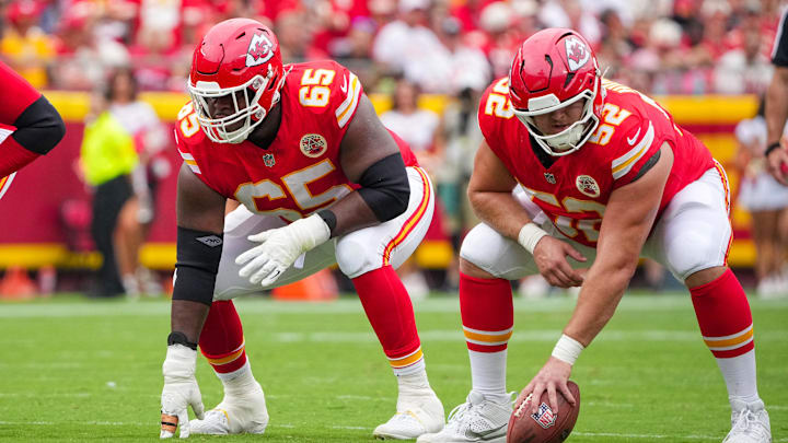 Sep 14, 2025; Kansas City, Missouri, USA; Kansas City Chiefs offensive tackle Jawaan Taylor (74) and guard Trey Smith (65) and center Creed Humphrey (52) at the line of scrimmage against the Philadelphia Eagles during the game at GEHA Field at Arrowhead Stadium. Mandatory Credit: Denny Medley-Imagn Images