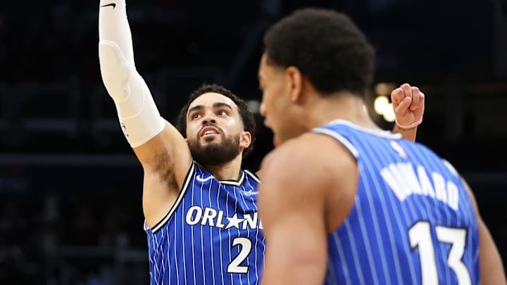 Jan 6, 2026; Washington, District of Columbia, USA; Washington Wizards guard Bub Carrington (7) takes a shot over Orlando Magic guard Tyus Jones (2) during the second half at Capital One Arena. Mandatory Credit: Daniel Kucin Jr.-Imagn Images