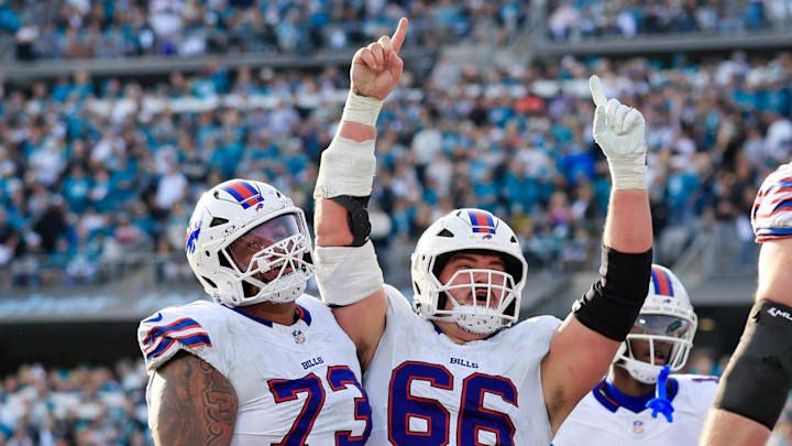Buffalo Bills center Connor McGovern (66) celebrates a touchdown from Buffalo Bills quarterback Josh Allen (17), not shown, during the fourth quarter of an NFL football AFC Wild Card playoff matchup, Sunday, Jan. 11, 2026, in Jacksonville, Fla. The Bills defeated the Jaguars 27-24. [Corey Perrine/Florida Times-Union]