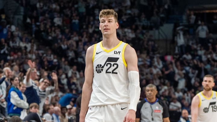 Apr 13, 2025; Minneapolis, Minnesota, USA; Utah Jazz forward Kyle Filipowski (22) fouls out and walks past Utah Jazz head coach Will Hardy as he heads to the bench in the fourth quarter against the Minnesota Timberwolves at Target Center. Mandatory Credit: Matt Blewett-Imagn Images
