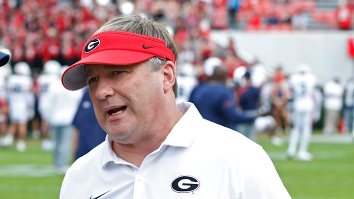 Auburn head coach Hugh Freeze speaks with Georgia head coach Kirby Smart before the start of a NCAA college football game against Auburn in Athens, Ga., on Saturday, Oct. 5, 2024.