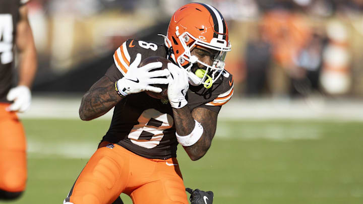 Oct 27, 2024; Cleveland, Ohio, USA; Cleveland Browns wide receiver Elijah Moore (8) makes a catch for a first down under coverage by Baltimore Ravens cornerback Brandon Stephens (21) during the fourth quarter at Huntington Bank Field. Mandatory Credit: Scott Galvin-Imagn Images