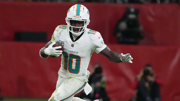 Nov 5, 2023; Frankfurt, Germany; Miami Dolphins wide receiver Tyreek Hill (10) carries the ball against the Kansas City Chiefs in the second half during an NFL International Series game at Deutsche Bank Park. Mandatory Credit: Kirby Lee-Imagn Images