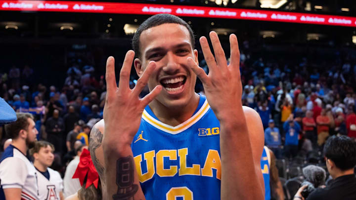 Dec 14, 2024; Phoenix, Arizona, USA; UCLA Bruins guard Kobe Johnson (0) celebrates after defeating the Arizona Wildcats at Footprint Center. Mandatory Credit: Mark J. Rebilas-Imagn Images Dec 14, 2024; Phoenix, Arizona, USA; UCLA Bruins guard Kobe Johnson (0) celebrates after defeating the Arizona Wildcats at Footprint Center. Mandatory Credit: Mark J. Rebilas-Imagn Images