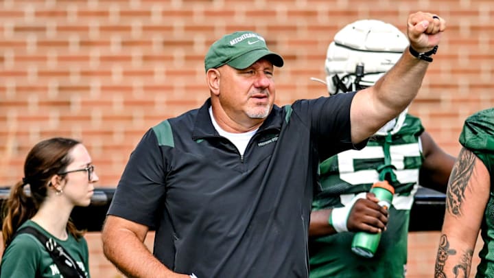 Michigan State's offensive line coach Jim Michalczik works with the team during the first day of football camp on Tuesday, July 30, 2024, in East Lansing. Michigan State's offensive line coach Jim Michalczik works with the team during the first day of football camp on Tuesday, July 30, 2024, in East Lansing.