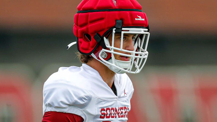 Taylor Heim runs through a drill at an Oklahoma practice.