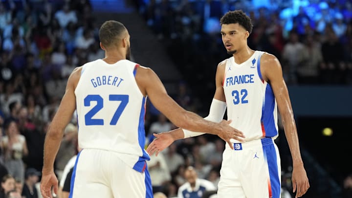 Aug 8, 2024; Paris, France; France centre Rudy Gobert (27) and power forward Victor Wembanyama (32) celebrate during the first half against Germany in a men's basketball semifinal game during the Paris 2024 Olympic Summer Games at Accor Arena. Mandatory Credit: Kyle Terada-Imagn Images Aug 8, 2024; Paris, France; France centre Rudy Gobert (27) and power forward Victor Wembanyama (32) celebrate during the first half against Germany in a men's basketball semifinal game during the Paris 2024 Olympic Summer Games at Accor Arena. Mandatory Credit: Kyle Terada-Imagn Images