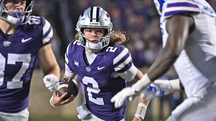  Quarterback Avery Johnson #2 of the Kansas State Wildcats runs with the ball behind tight end Brayden Loftin #87 in the second half against the Kansas Jayhawks at Bill Snyder Family Football Stadium on October 26, 2024 in Manhattan, Kansas.