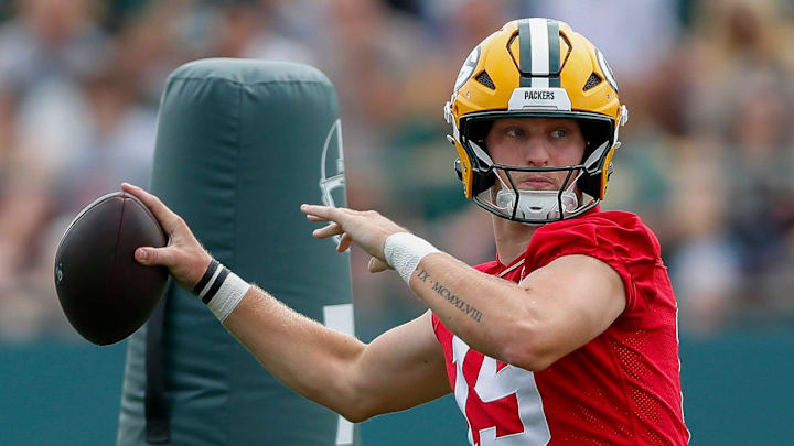 Green Bay Packers quarterback Taylor Elgersma (19) passes the ball at training camp.